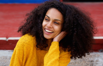 A beautiful young Afro-American woman with a perfect smile.