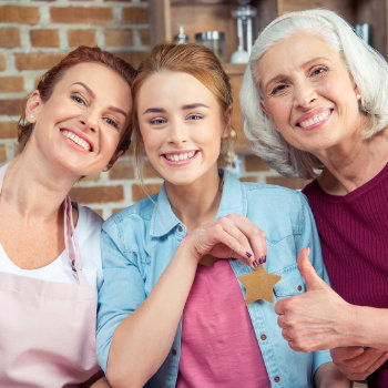 three smiling women three generations